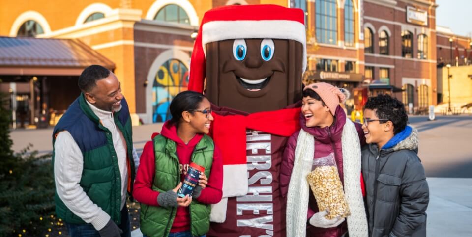 Family and Hershey's character at Hersheypark Christmas Candylane