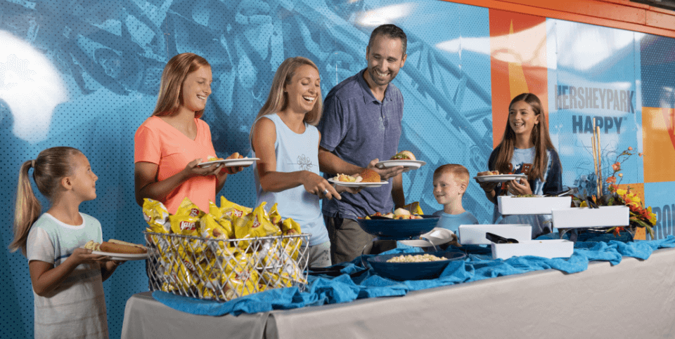 Family eating at a groups picnic